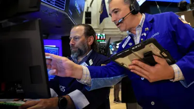 Dow closes above 52,000 for the first time